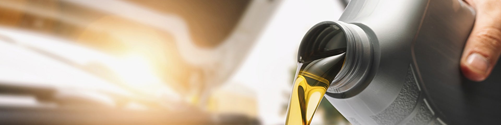 Close up view of auto oil being poured